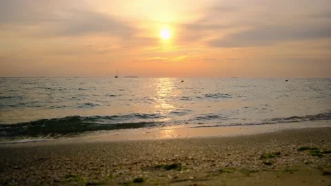 Sea waves during sunrise. Waves crashing on beach, sea wave on the sand Stock Footage 197540965