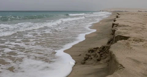 Sea waves on an empty sandy beach Stock Footage 122206890