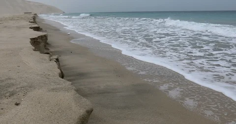 Sea waves on an empty sandy beach Видео 122207570