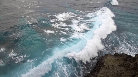 Sea waves explode on the rocky shore Stock Footage 76892834