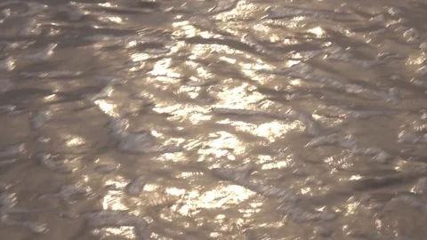 Sea waves with flecks of sunlight on the water and sand surface. 4K Vídeos de archivo 70363076