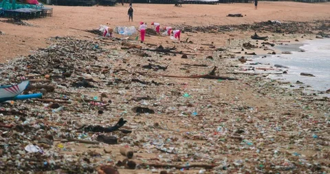 Sea waves full of litter hitting the beach. Huge dump in tropical paradise. M Stock Footage 127370241