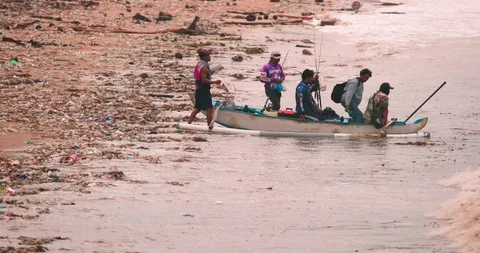 Sea waves full of litter hitting the beach. Huge dump in tropical paradise. M Stock Footage 127375520