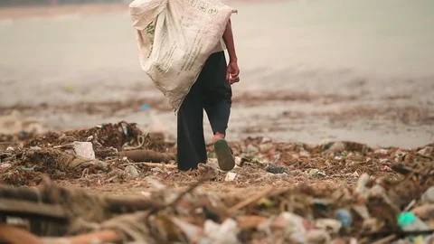 Sea waves full of litter hitting the beach. Huge dump in tropical paradise. M Video stock 127393476