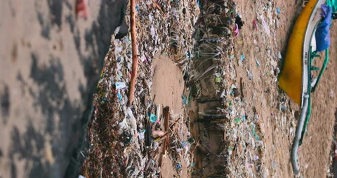 Sea waves full of litter hitting the beach. Huge dump in tropical paradise. M Stock Footage 127475129