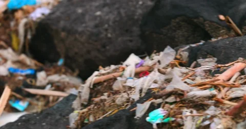 Sea waves full of litter hitting the beach. Huge dump in tropical paradise. M Stock Footage 127479909