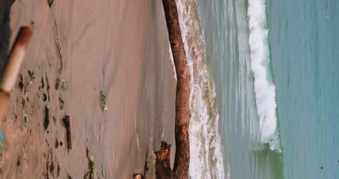 Sea waves full of litter hitting the beach. Huge dump in tropical paradise. M Video stock 127492667