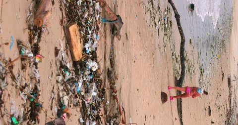 Sea waves full of litter hitting the beach. Huge dump in tropical paradise. M Stock Footage 127492918