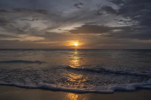 Sea waves on grey sunset background Stock Photos