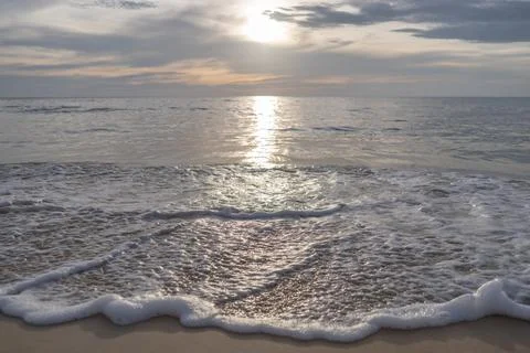 Sea waves on grey sunset background Stock Photos