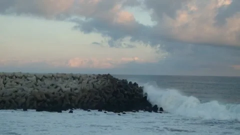 Sea waves hit concrete breakwaters Video stock 291472065