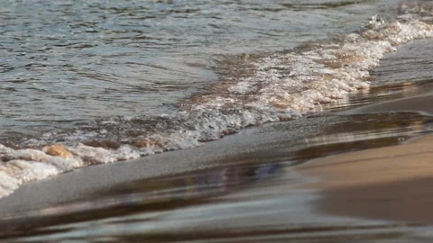 Sea waves hit sandy beach Stock Footage 309920209