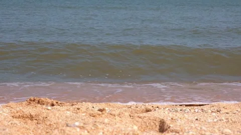 Sea waves hit the sandy shore. coast of sea. Wind and waves on a sunny day. Stock Footage 233847634