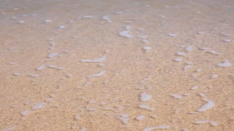 Sea waves hit the sandy shore. coast of sea. Wind and waves on a sunny day. Stock Footage 235316623