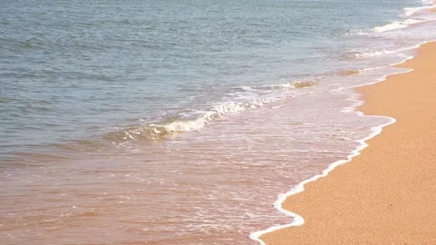 Sea waves hit the sandy shore. coast of sea. Wind and waves on a sunny day. Stock Footage 236423955