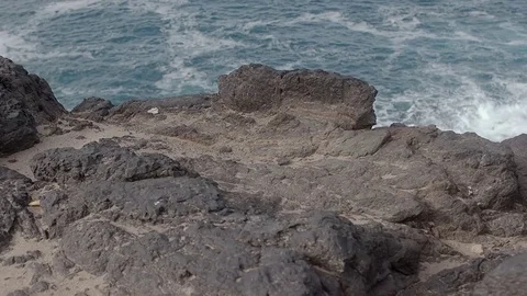 Sea waves hitting big rocks. Big stormy waves crashing on the rocks. Aerial view Stock Footage 85285860