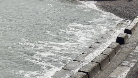 Sea waves hitting concrete steps slow motion Stock Footage 336504600