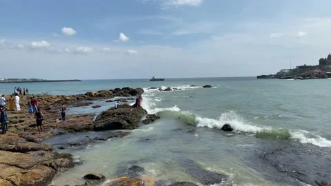 Sea waves hitting rocks on the beach Video stock 164871413