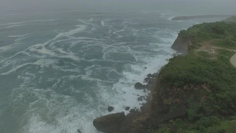 Sea waves hitting rocks in a cliff Stock Footage 114350297
