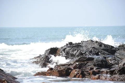 Sea waves hitting the rocks. Stock Photos