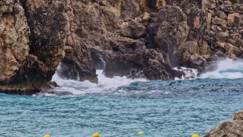 Sea waves hitting rocks on a stormy day in Paleokastritsa in Corfu, Greece Stock Footage 240501583
