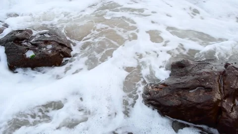 Sea waves hitting rocks top angle close up Stock Footage 156464099