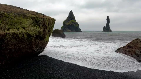 Sea waves impact over black sand beach Video stock 296063300