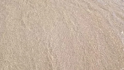 Sea waves that move gently to the beach sand Stock Footage 214664594