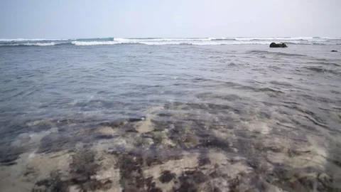 Sea ​​waves that move into shallow coastal waters and coral reefs. Stock Footage 276942698