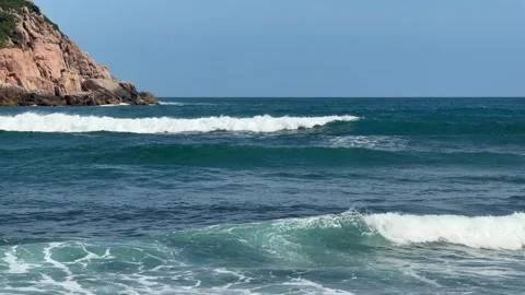 Sea waves move toward the coast, surface rising and falling across open water Stock Footage 329373422