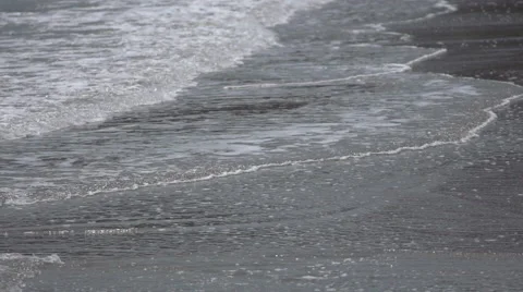 Sea waves over sand beach in slow motion 2 Stock Footage 51023582