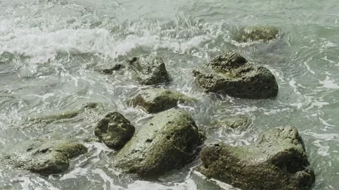 Sea waves over small rocks Stock Footage 330938662