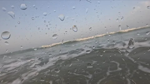 Sea waves pass over an underwater camera at sunset with split surface views.. Stock Footage 345804487