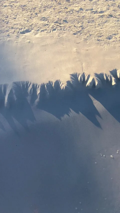Sea waves. Patterns on the sand. Beach. Sunset. Vertical video Stock Footage 287498971