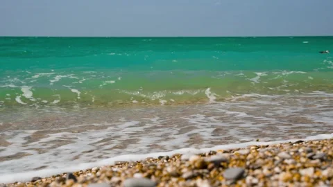 Sea waves on a pebble beach, a beautiful soothing background Stock Footage 161143451