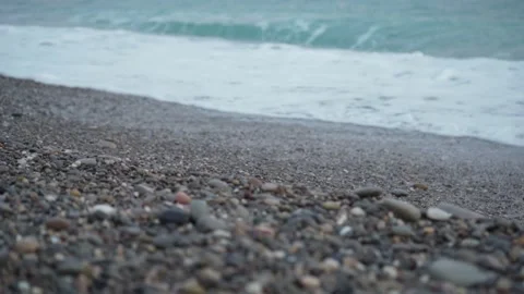 Sea waves on pebble beach texture background on sunset. Transparent ocean water Video stock 237866551