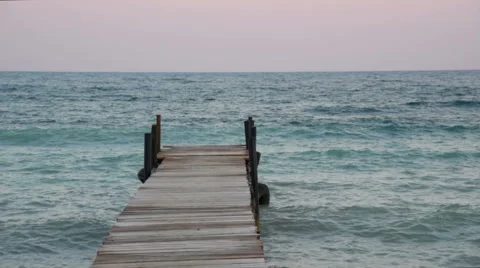Sea waves at the pier at sunset Stock-Footage 68851108