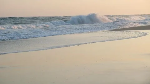Sea Waves - Powerfull waves crash onto shore in sunset distance Vídeos de archivo 244686163