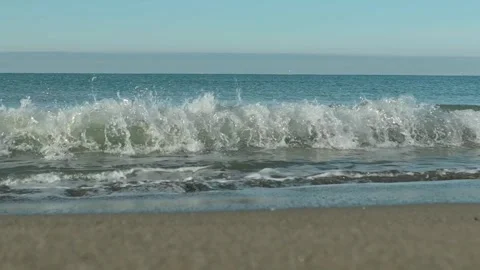 Sea waves with rays of sun in slow motion Stock Footage 265080887