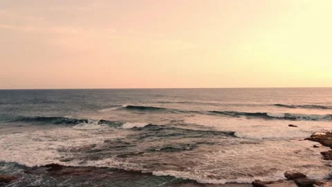 Sea waves in the rays of sunset light in Cyprus. Stock Footage 175057670