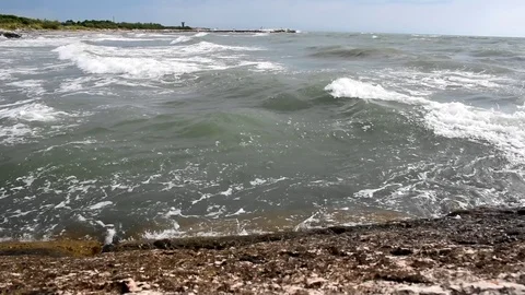 Sea waves reaching the rock Video stock 112657898