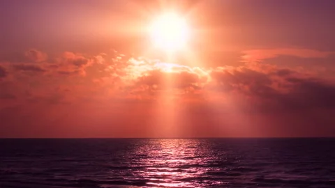 Sea waves with reflection of red sunlight on purple background. 库存影片 242157656