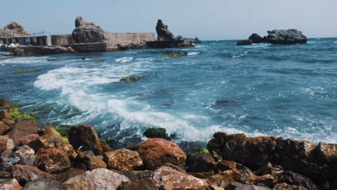Sea waves into rocks Stock Footage