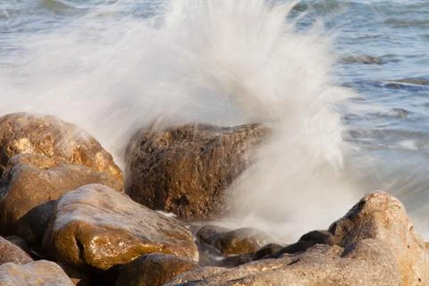 Sea waves on the rocks Stock Photos