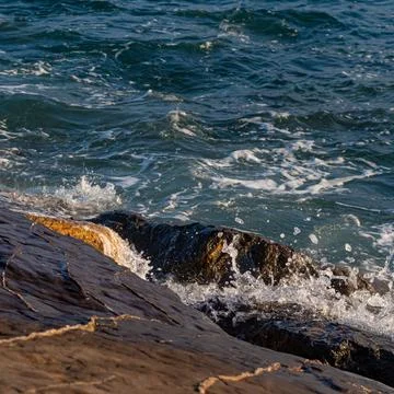 Sea waves on rocks Stock Photos
