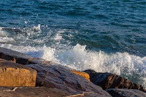Sea waves on the rocks Stock Photos