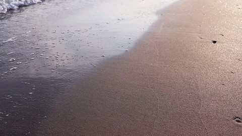 Sea ??waves roll ashore at sunset Stock Footage 125666895