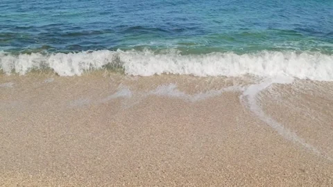 Sea waves roll on coast of sandy beach 库存影片 310798095