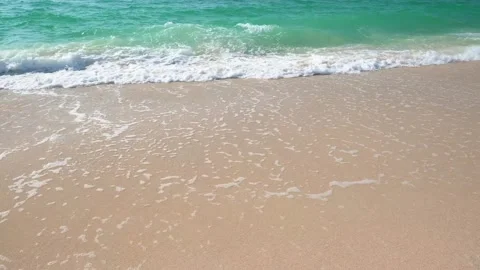 Sea waves roll on coast of sandy beach Stock-Footage 310798964