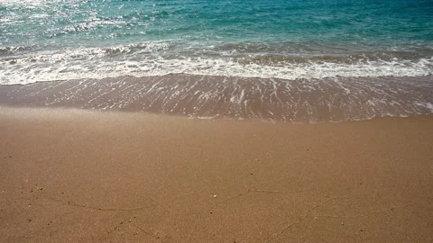 Sea waves roll over the sandy beach Stock Footage 132481769